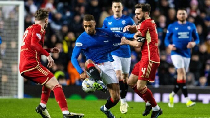 Aberdeen suffer 2-1 defeat to Rangers in Neil Warnock’s first game in charge Neil Warnock's tenure with Aberdeen began at Ibrox with a close 2-1 loss to Rangers.