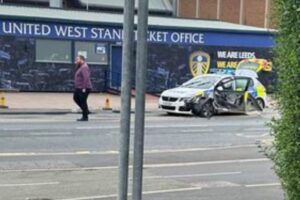 Leeds United defender involved in police car crash with officer treated at Elland Road scene.