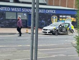 Leeds United defender involved in police car crash with officer treated at Elland Road scene.